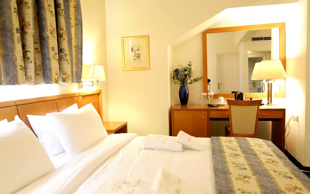 Spacious bedroom with elegant furnishings at Hotel Philippos Livadia Spacious bedroom with elegant furnishings at Hotel Philippos Livadia