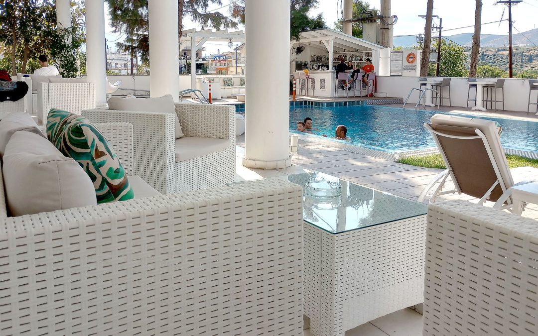 Outdoor swimming pool at Hotel Philippos Livadia surrounded by peaceful summer setting Outdoor swimming pool at Hotel Philippos Livadia surrounded by peaceful summer setting