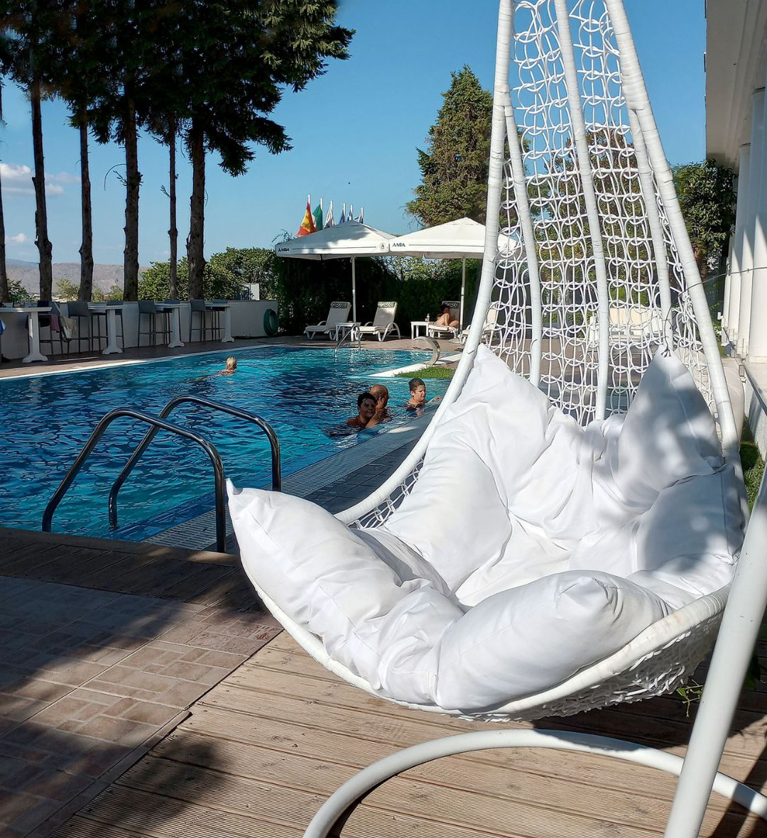 Stylish guest room at Hotel Philippos with premium bedding and elegant details